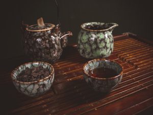 green and brown ceramic teapot