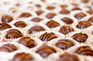 a close up of a tray of chocolates