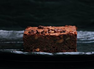 sliced baked brownies on foiled tray